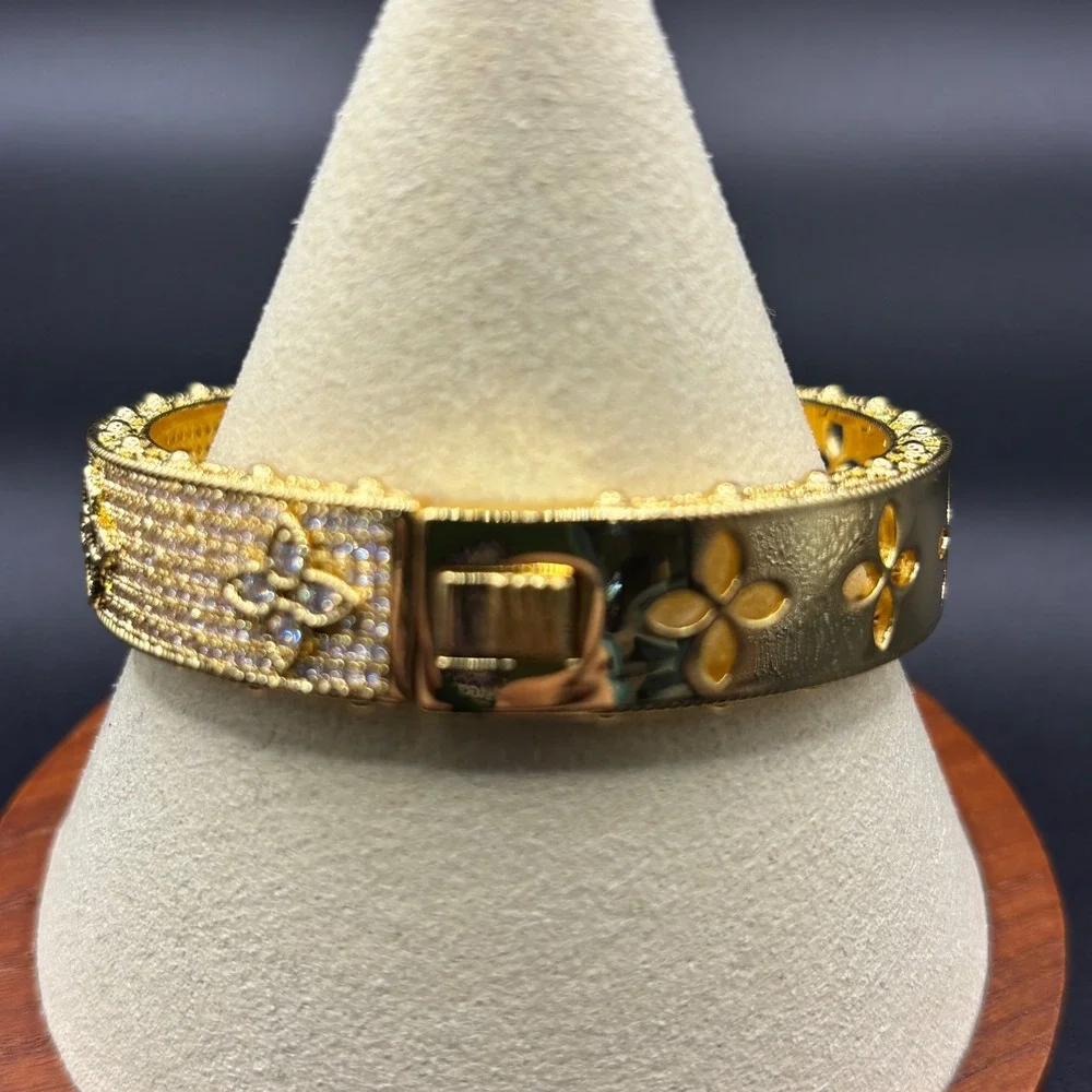 Gold Tone Crystal Pave Floral Quatrefoil Hinged Bangle Bracelet 6.75 Inch